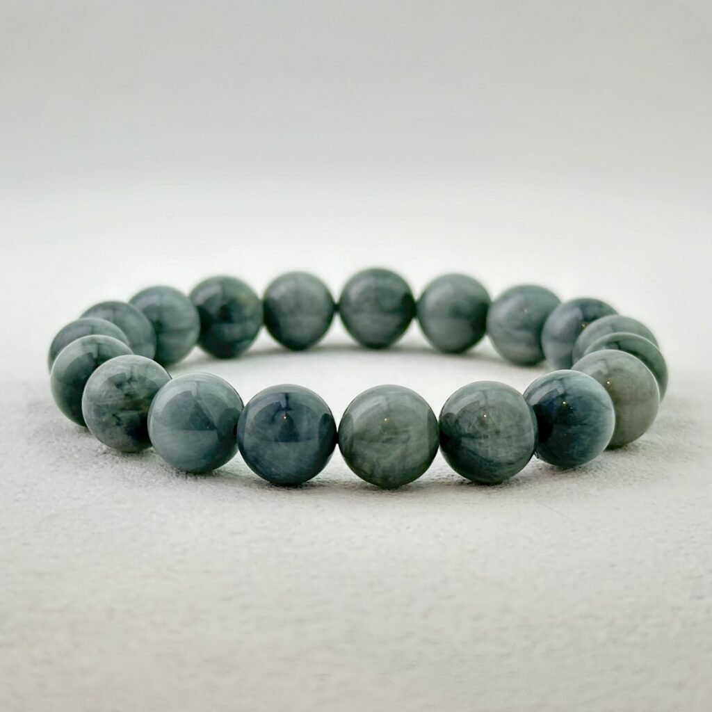 Natural Hawk's Eye Bracelet with blue-gray polished beads for Calm Precision and Strategic Insight.