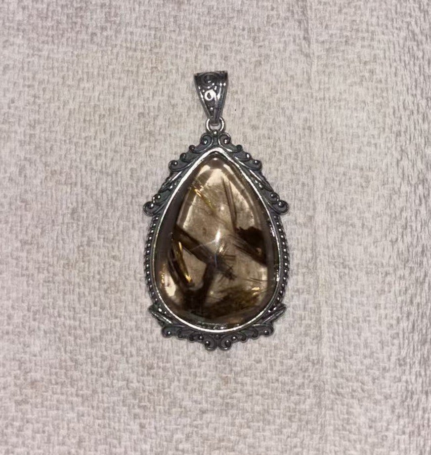 Rutilated Quartz Pendant — The Echoes of the Earth Veins